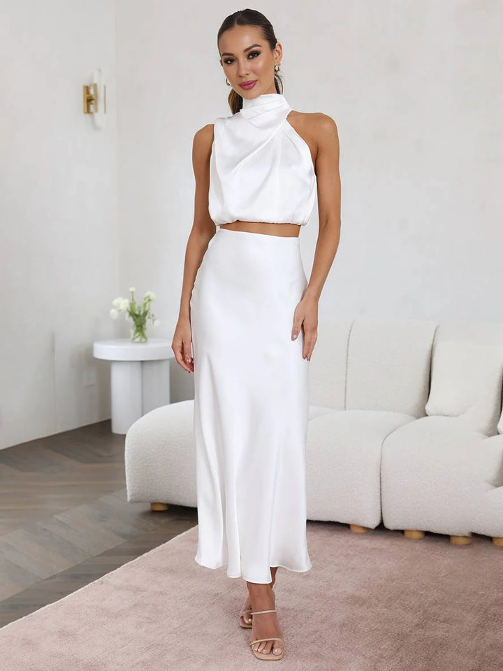 Completo da donna in due pezzi con scollo all'americana e gonna lunga